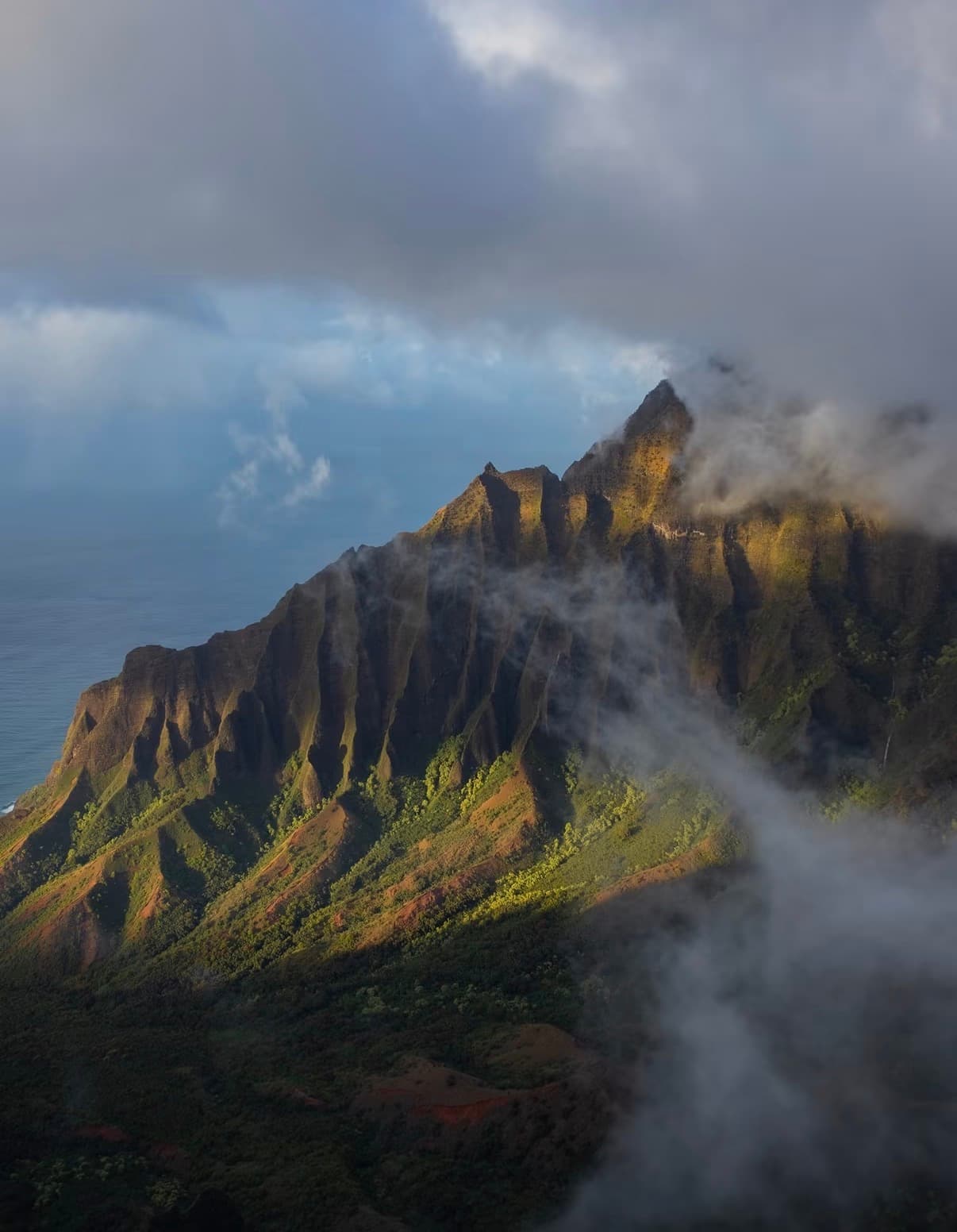The Kalalau Valley ridge in late light, with cloud drifting through