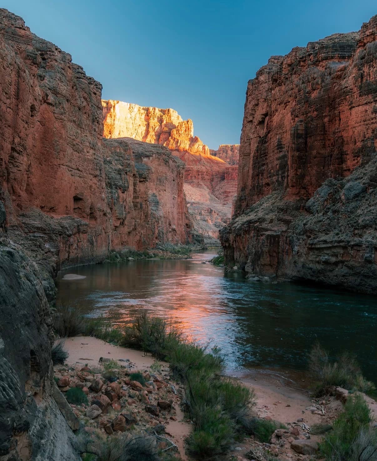 Evening light on canyon walls reflected in the river