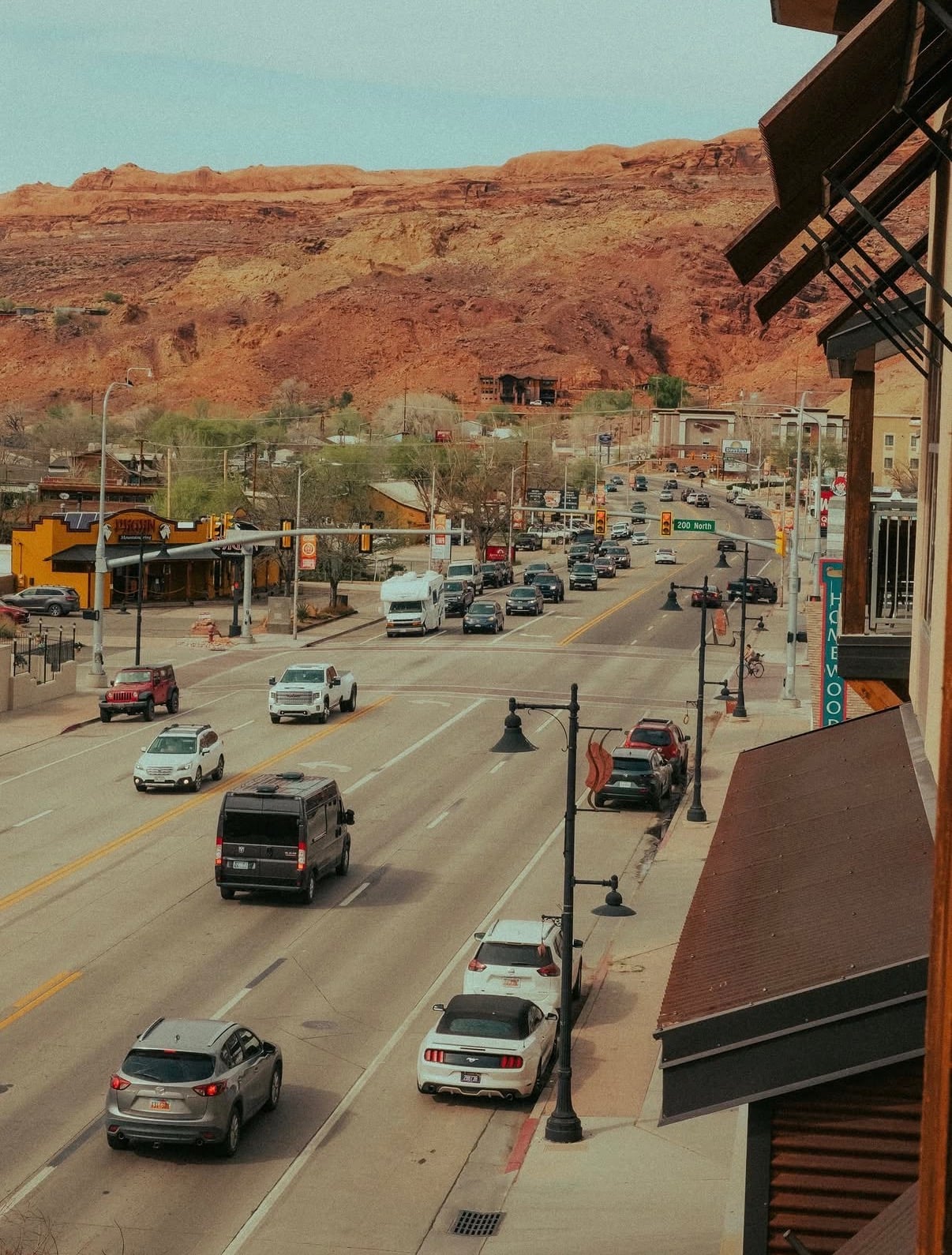 Moab's main street running toward red-rock cliffs