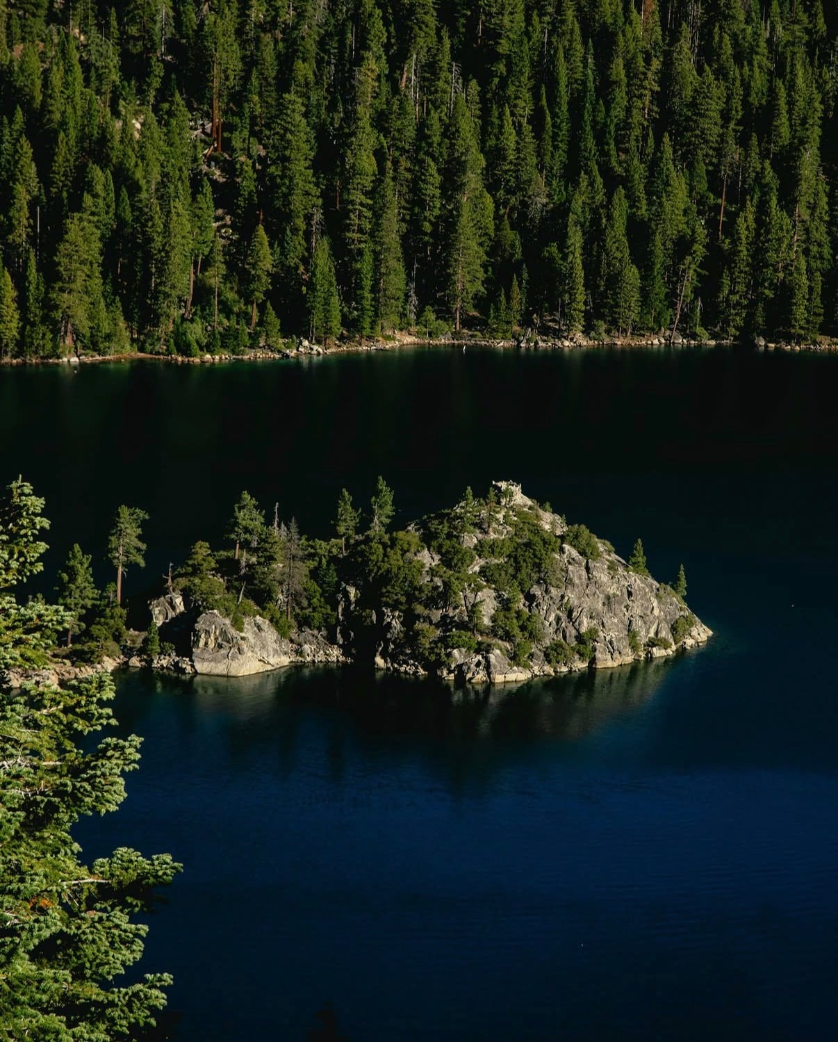 Fannette Island in Emerald Bay, Lake Tahoe, under pine-covered slopes