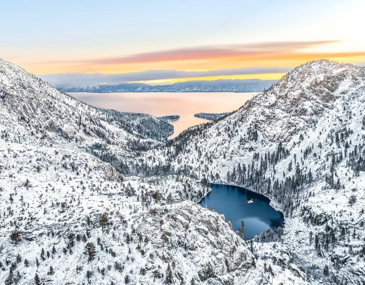 Snow-covered mountains above Lake Tahoe at sunset